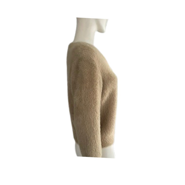 Beige sweater on a mannequin against a white background