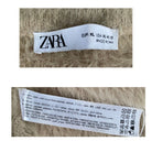 Zara label on a textured fabric background