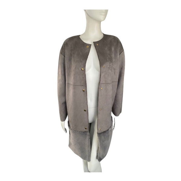 Mannequin wearing a gray suede jacket on a white background