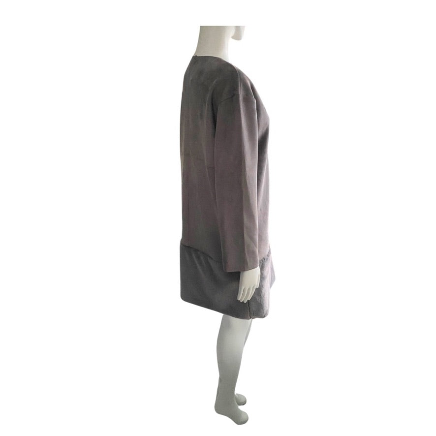 Mannequin wearing a two-tone dress with a brown top and gray skirt on a white background