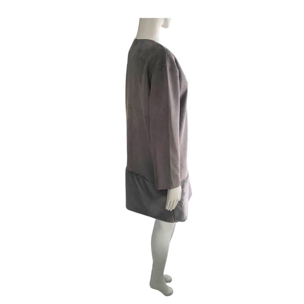 Mannequin wearing a two-tone dress with a brown top and gray skirt on a white background