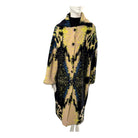 Mannequin wearing a patterned coat on a white background