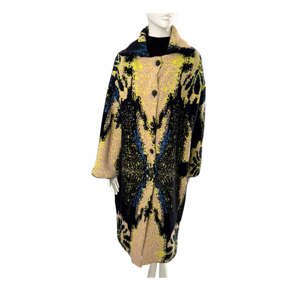 Mannequin wearing a patterned coat on a white background