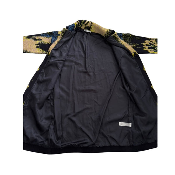 Black jacket lining with patterned sleeves on a white background