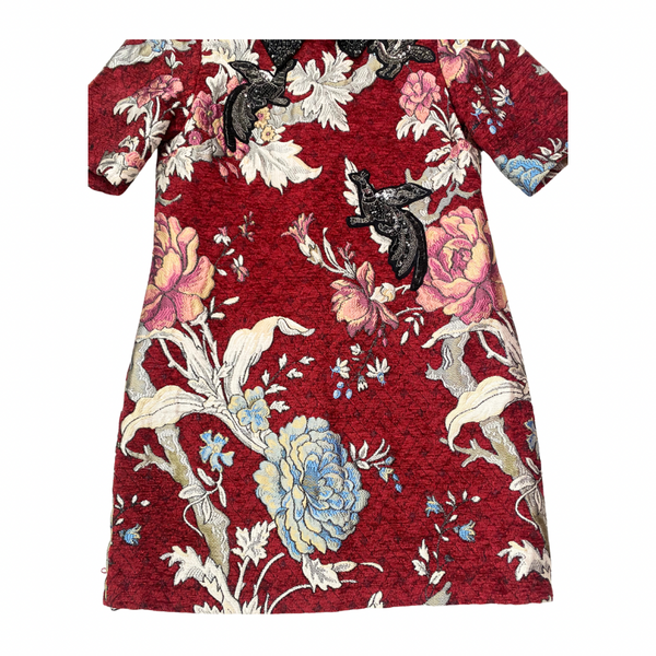 Floral dress with a red background on a white background