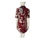 Red floral dress on a mannequin against a white background