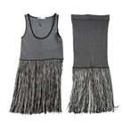 Black and white striped dress with frayed hem on a white background