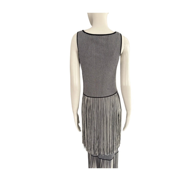Mannequin wearing a black and white striped dress on a white background
