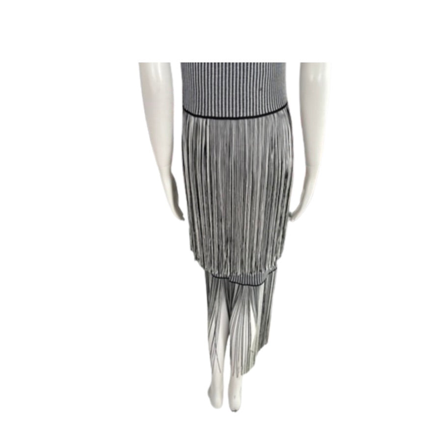 Mannequin wearing a gray pleated skirt on a white background