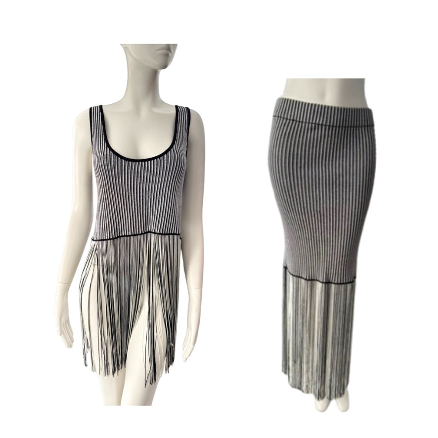 Mannequin wearing a black and white striped dress with fringe details on a white background