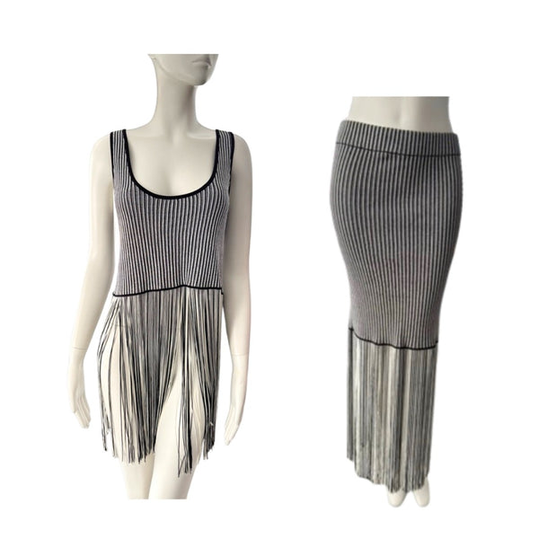 Mannequin wearing a black and white striped dress with fringe details on a white background