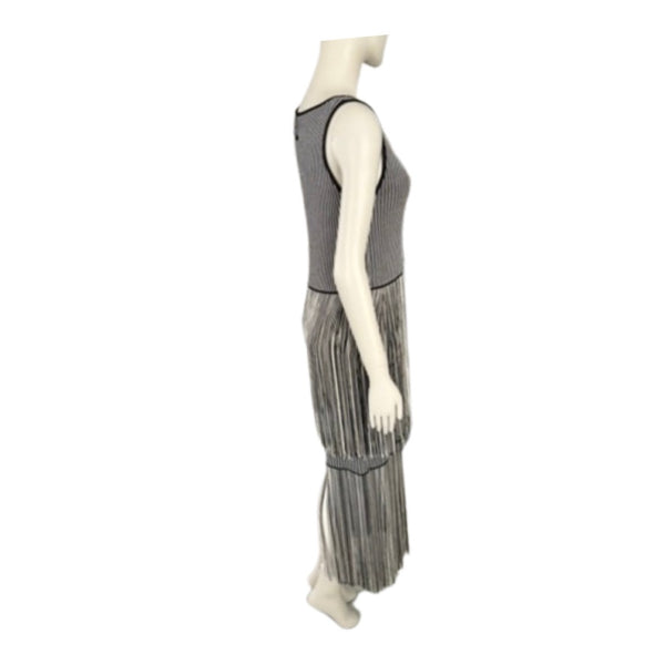Mannequin wearing a gray pleated dress on a white background