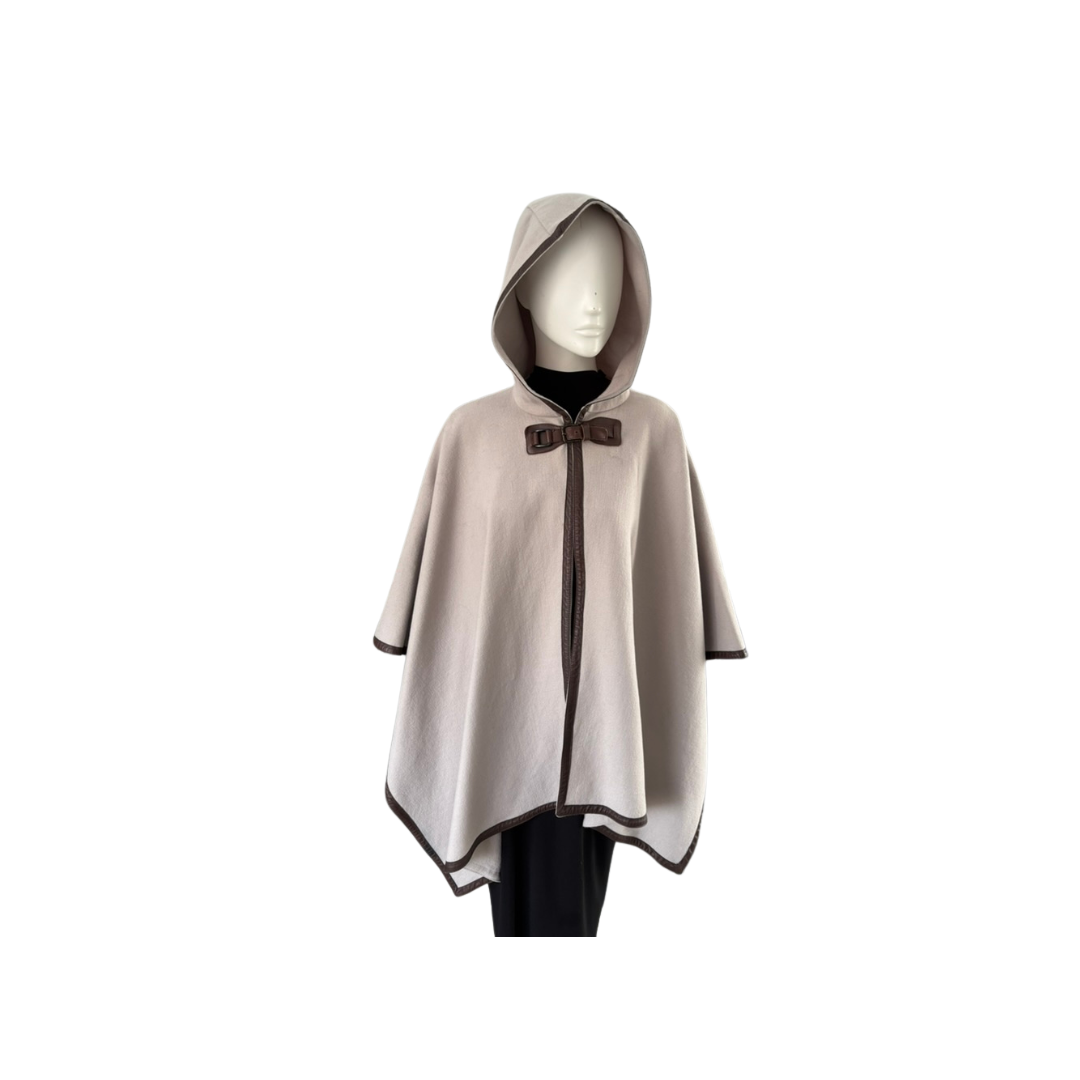 Beige hooded cape with a brown bow on a white background