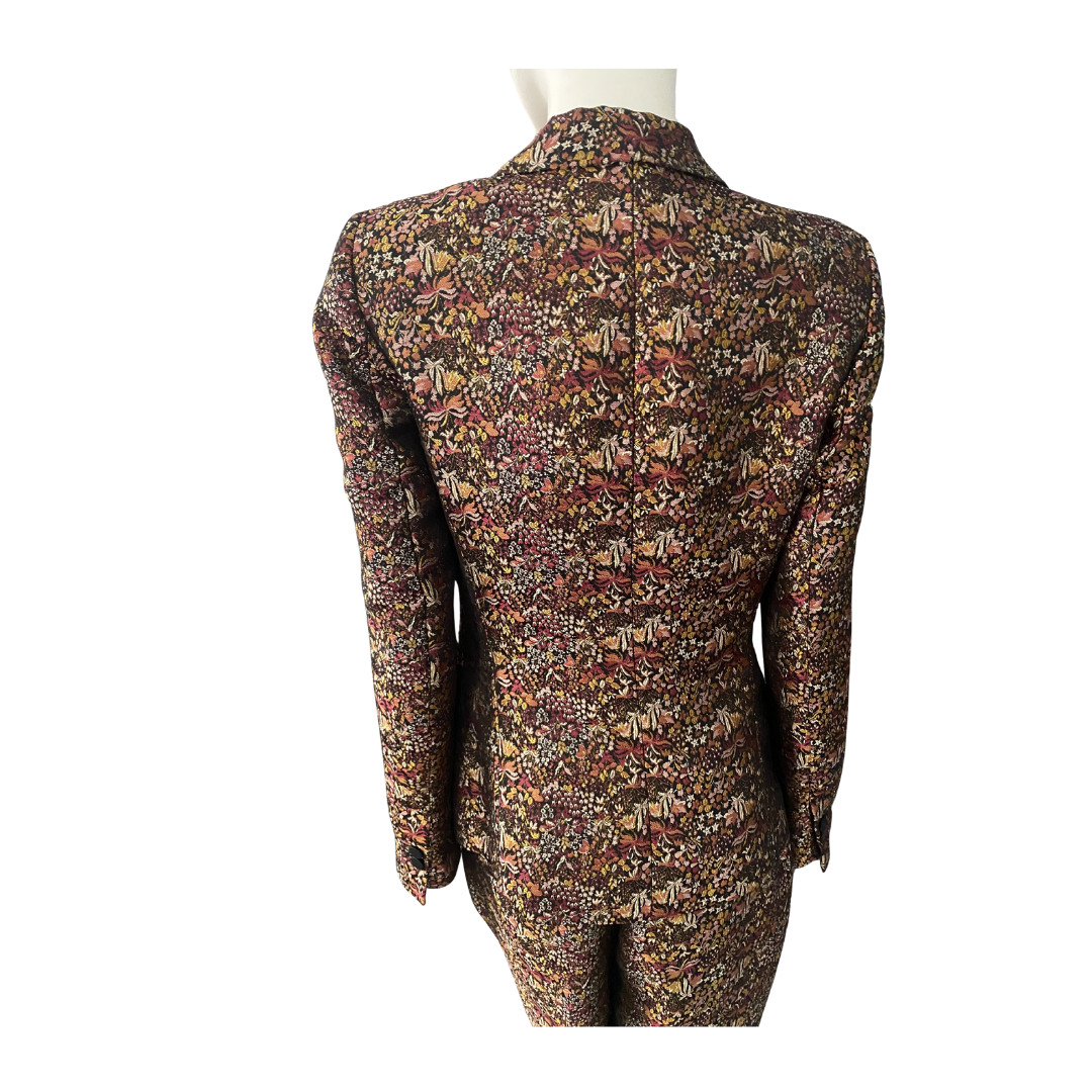 Floral patterned suit jacket on a mannequin against a white background