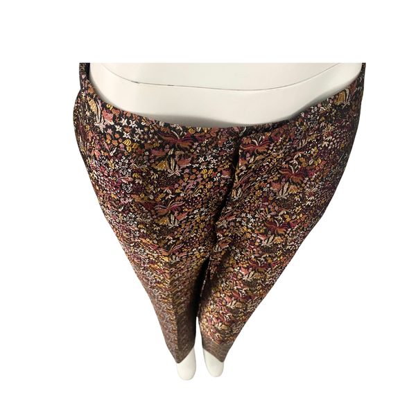 Floral patterned pants on a mannequin against a white background