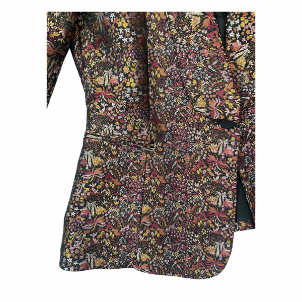 Floral patterned shirt with a collar on a white background