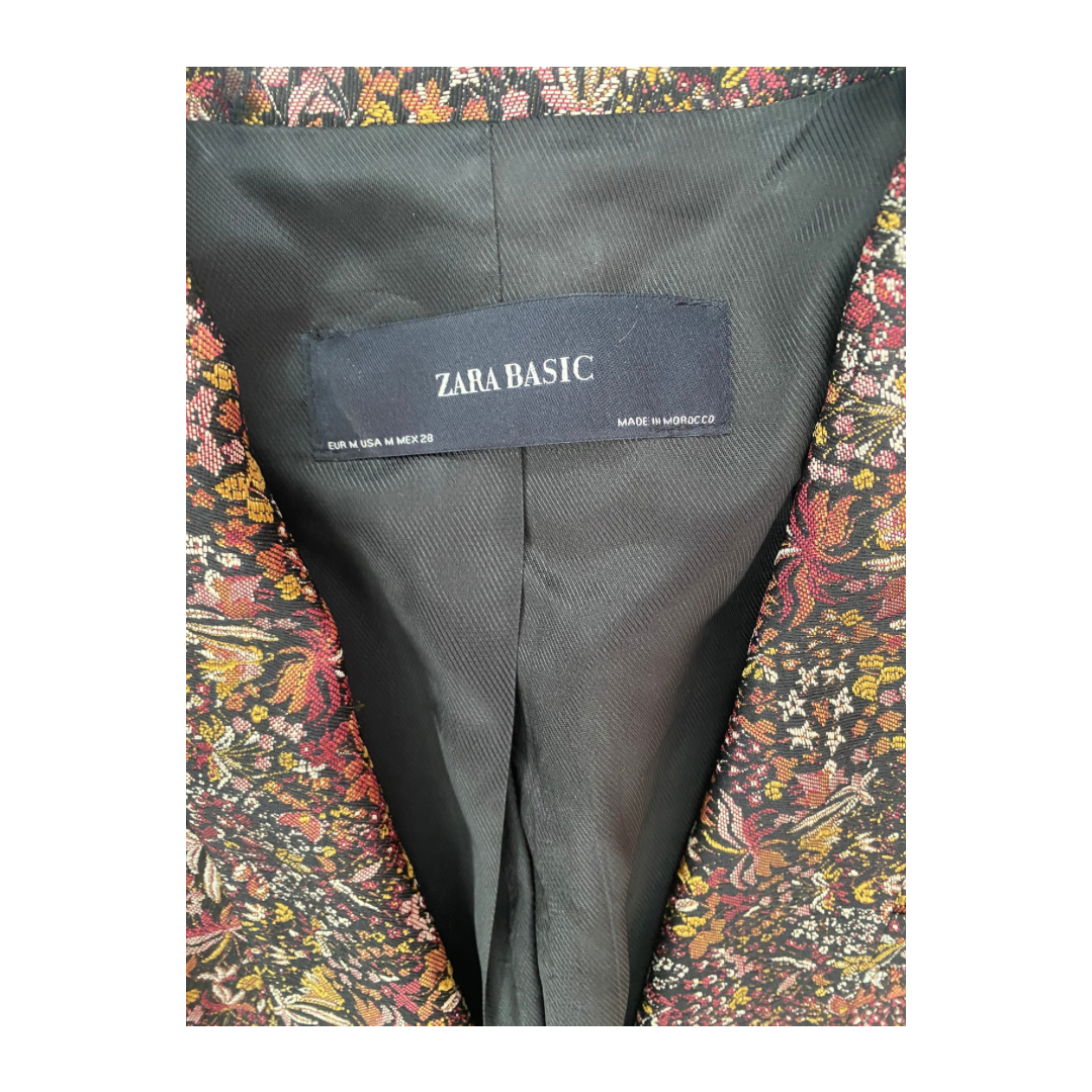 Zara Basic label on a dark gray fabric with a colorful floral patterned lining.