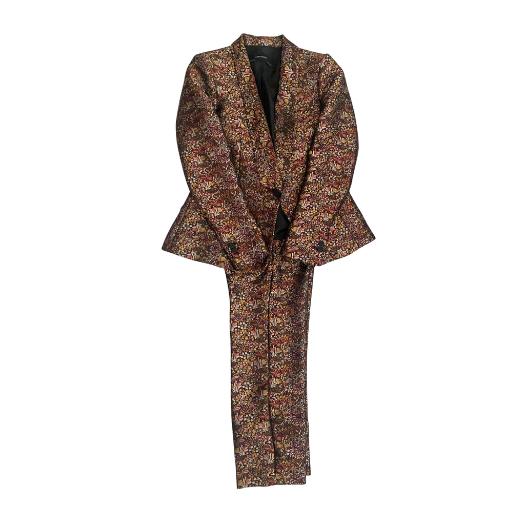 Floral patterned suit jacket and pants on a white background