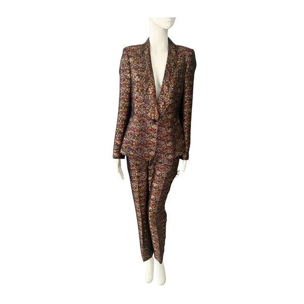 Floral patterned suit on a mannequin against a white background
