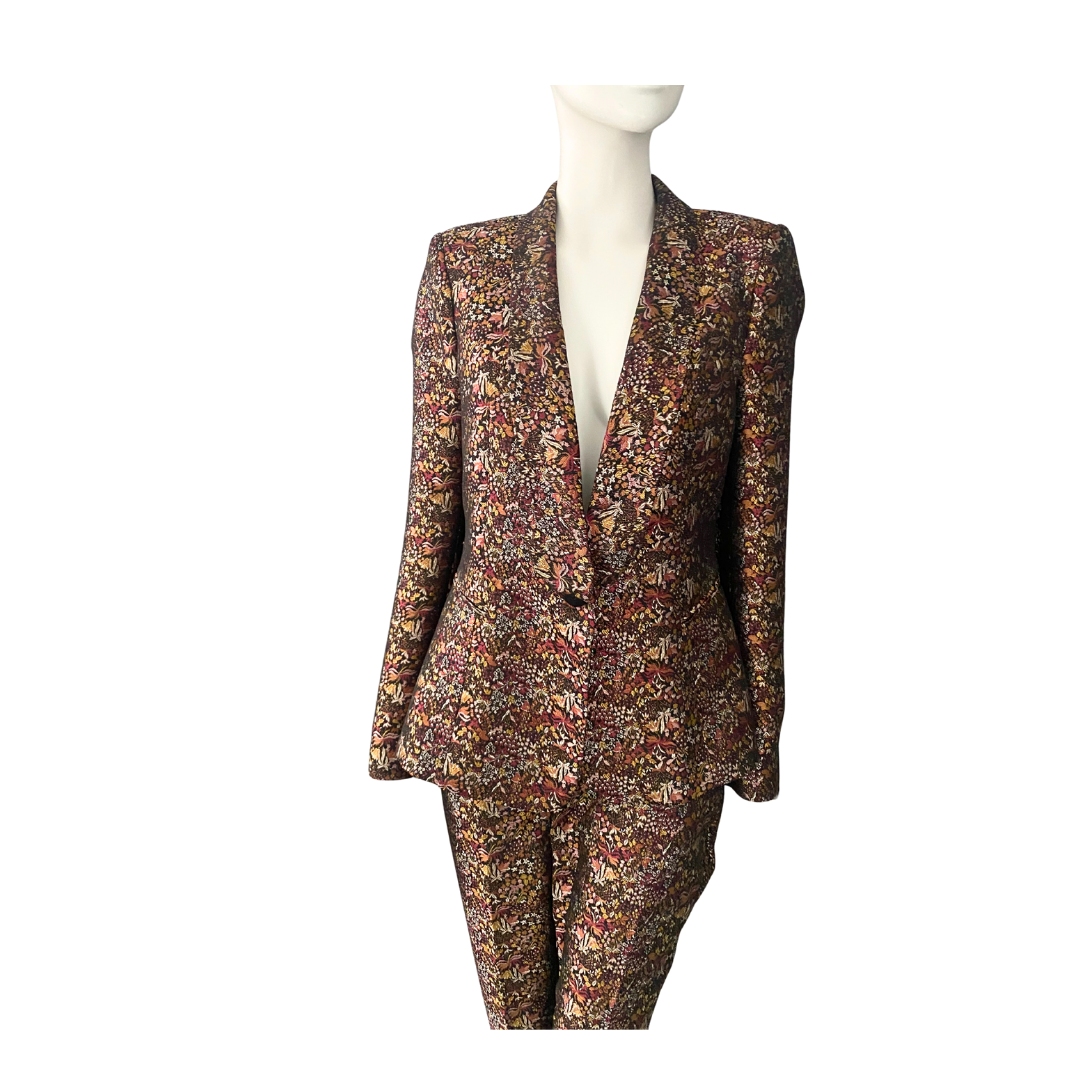 Floral patterned suit on a mannequin against a white background