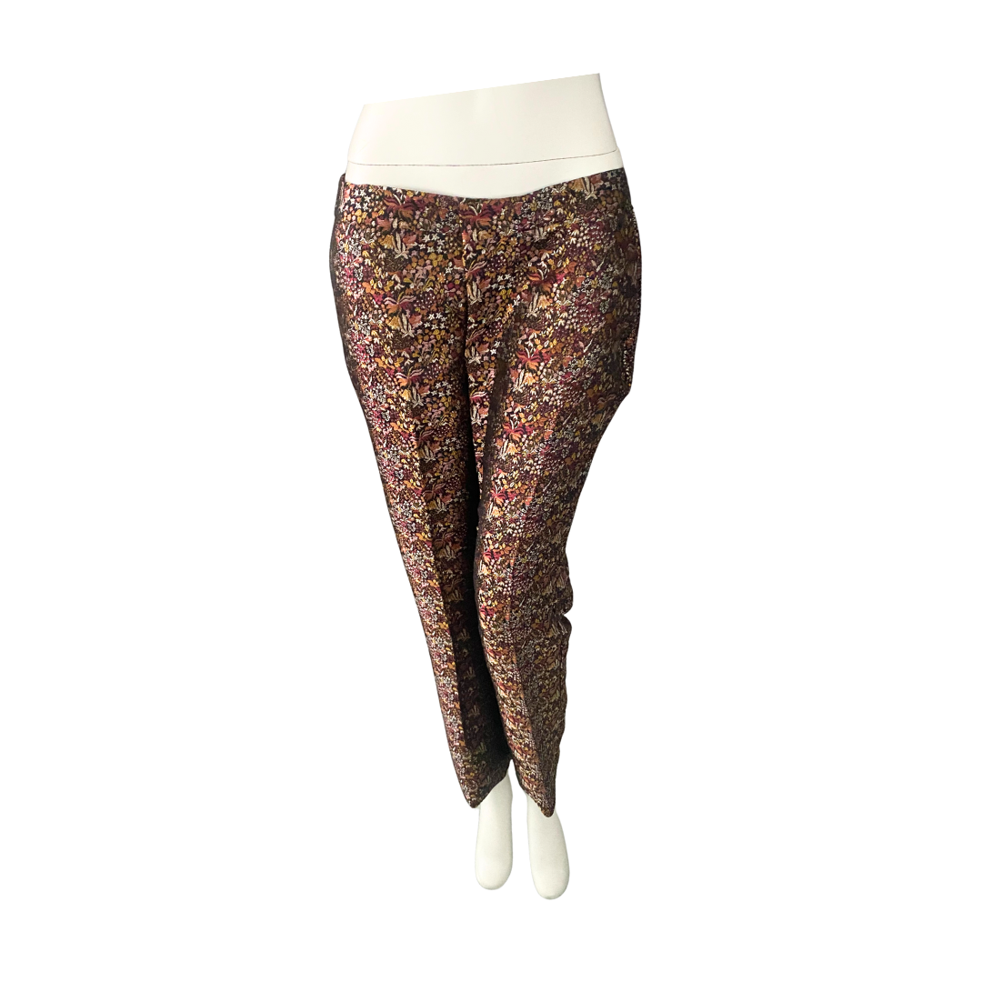 Patterned trousers on a mannequin against a white background