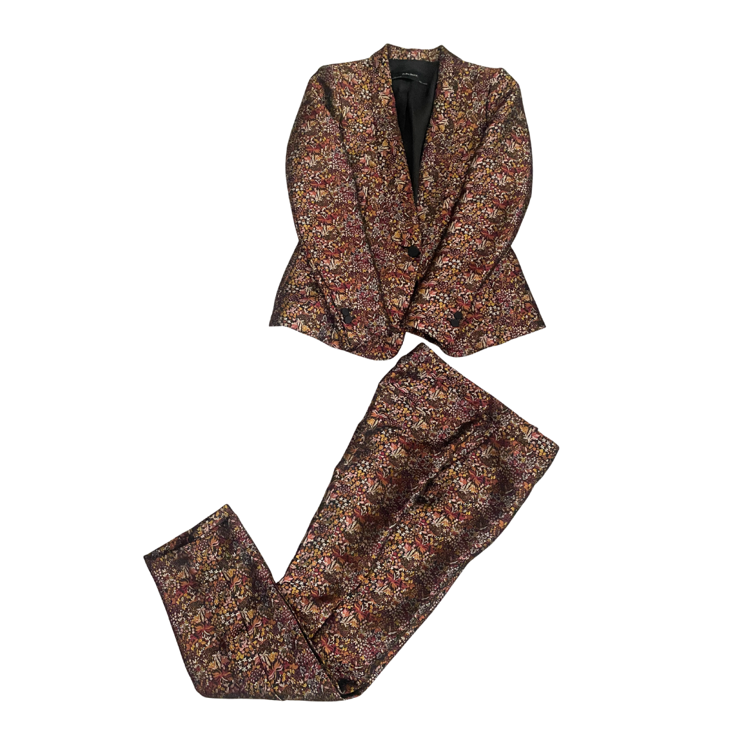 Floral patterned suit jacket and pants on a white background