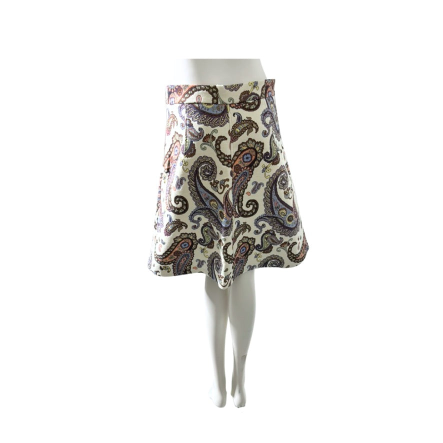 Patterned skirt on a mannequin against a white background