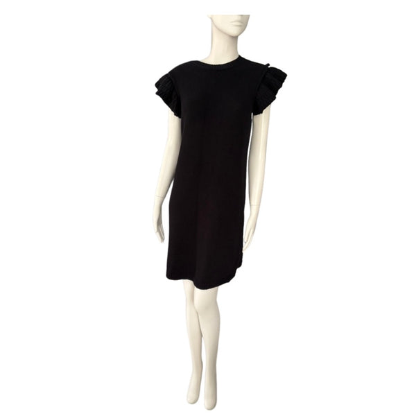 Black dress on a mannequin against a white background