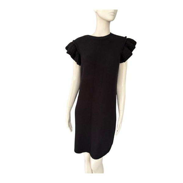 Black dress with ruffled sleeves on a mannequin against a white background