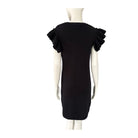 Black dress with ruffled shoulders on a mannequin against a white background
