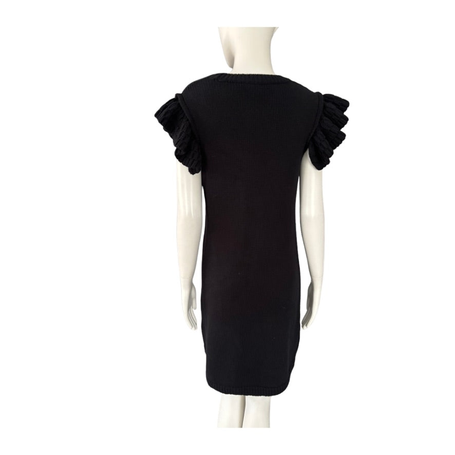 Black dress with ruffled shoulders on a mannequin against a white background