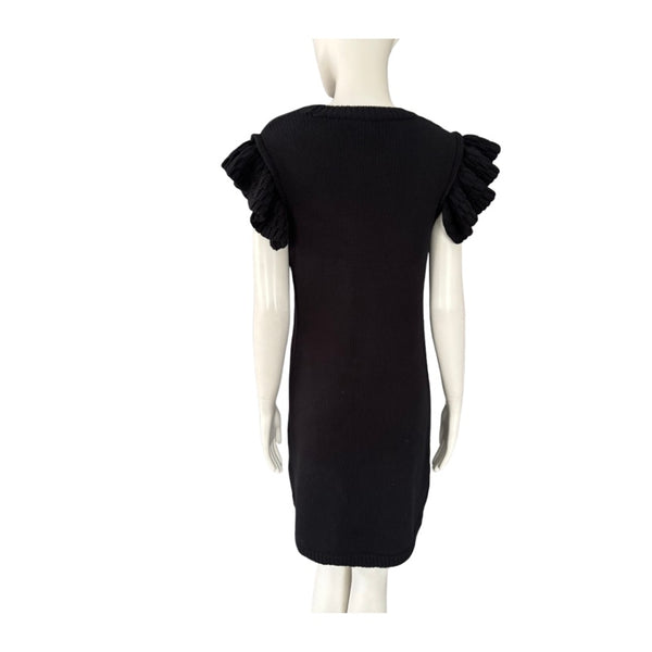 Black dress with ruffled shoulders on a mannequin against a white background