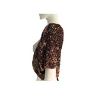 Bronze sequin top on a mannequin against a white background