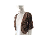Brown sequined shrug on a mannequin against a white background