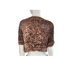 Brown sequin shrug on a mannequin against a white background