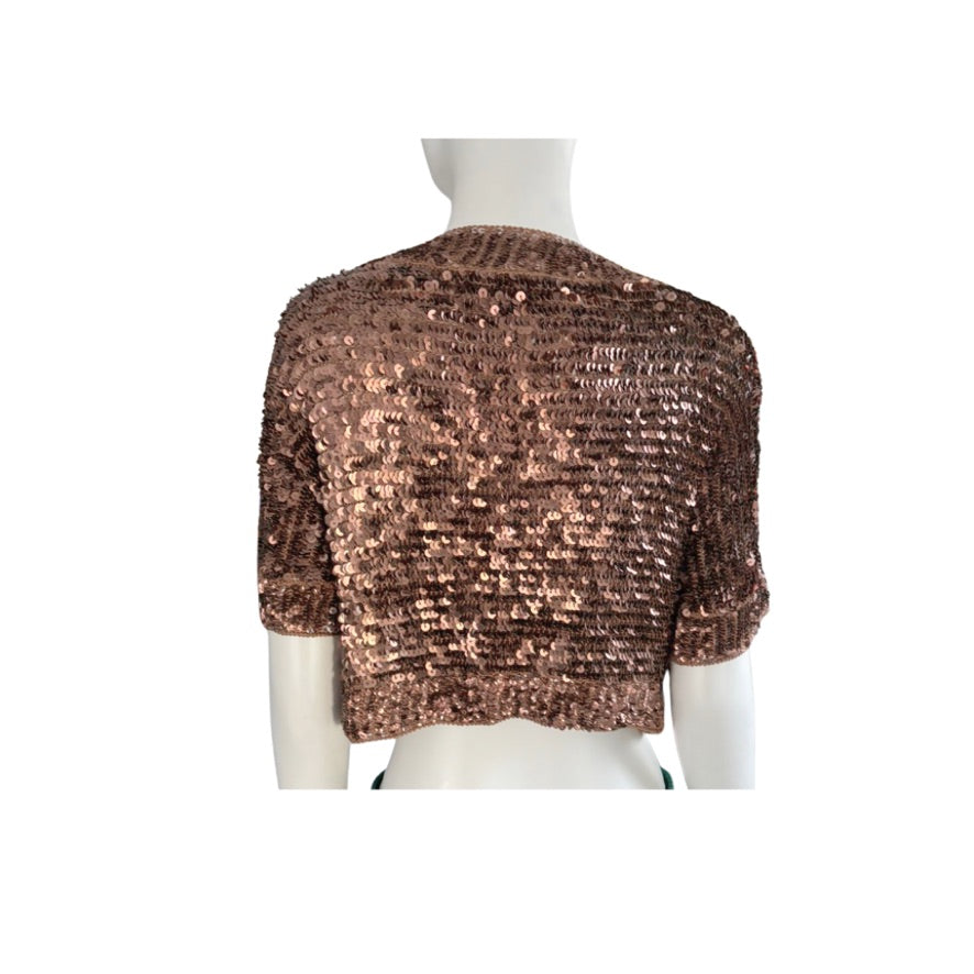 Brown sequin shrug on a mannequin against a white background