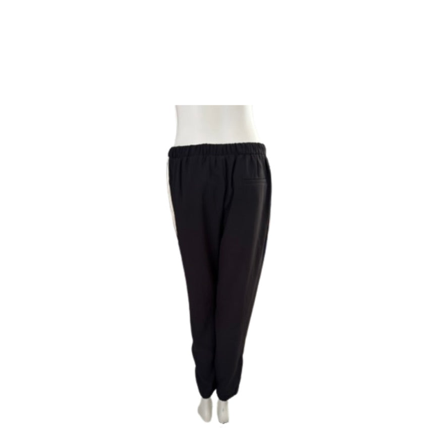 Black pants on a white mannequin against a white background