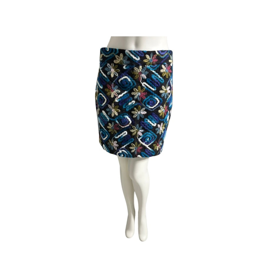 Patterned skirt on a mannequin against a white background