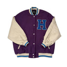Purple varsity jacket with blue 'H' and cream sleeves on a white background