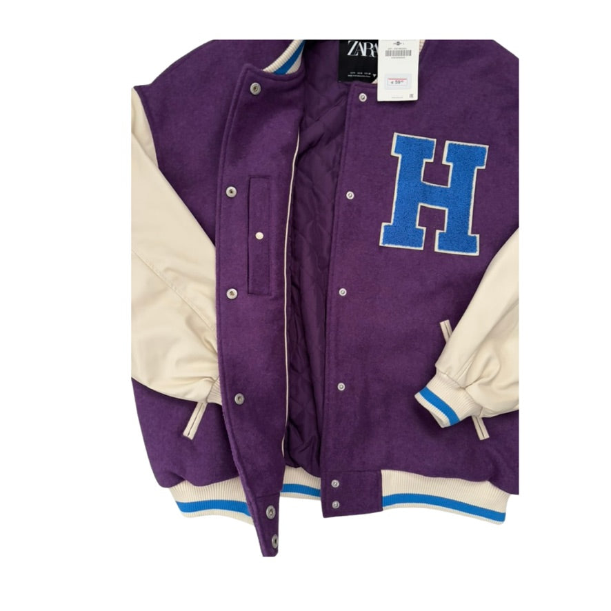 Purple varsity jacket with blue 'H' and white sleeves on a white background