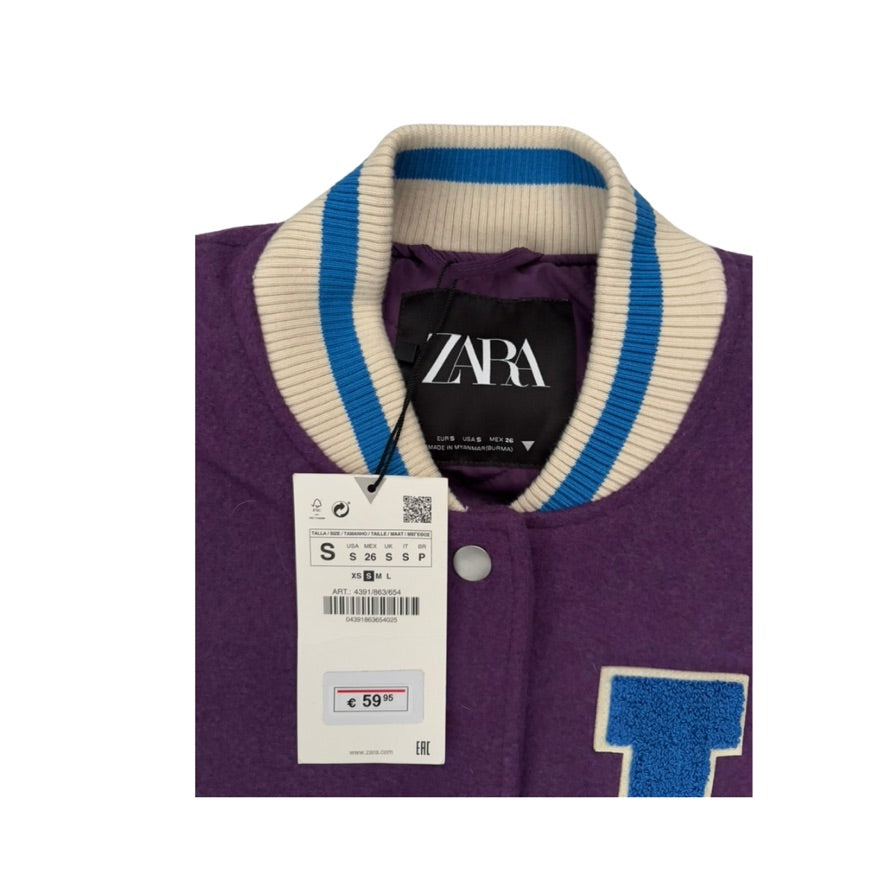 Purple jacket with a Zara tag on a white background